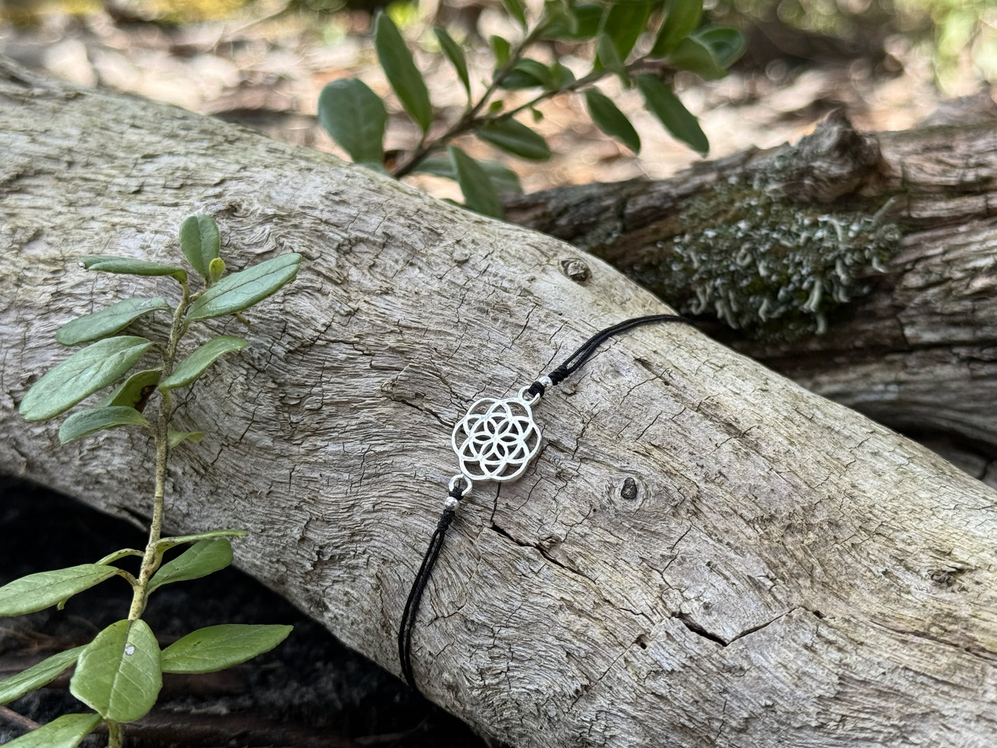 Bracelet made of silver beads with small flowers