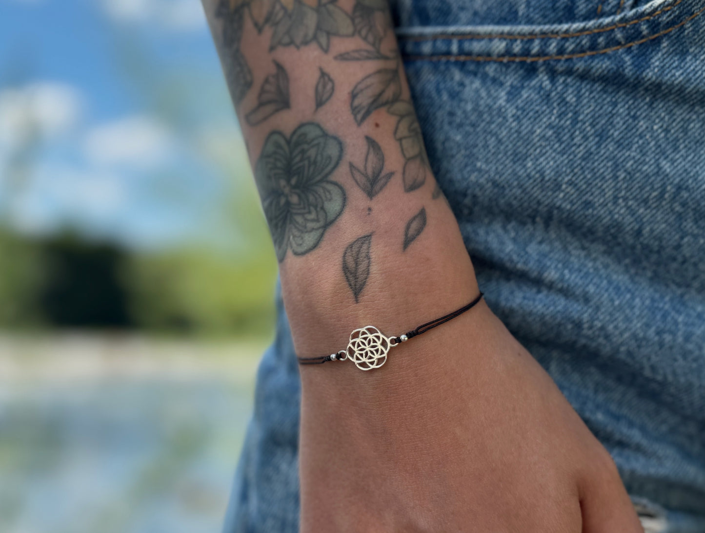 Bracelet made of silver beads with small flowers