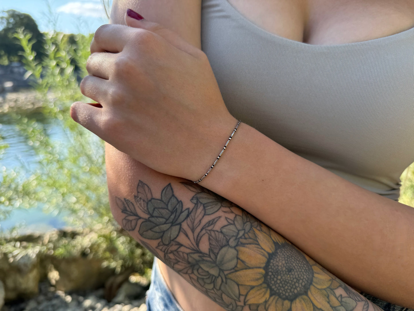 Bracelet made of silver beads with small flowers