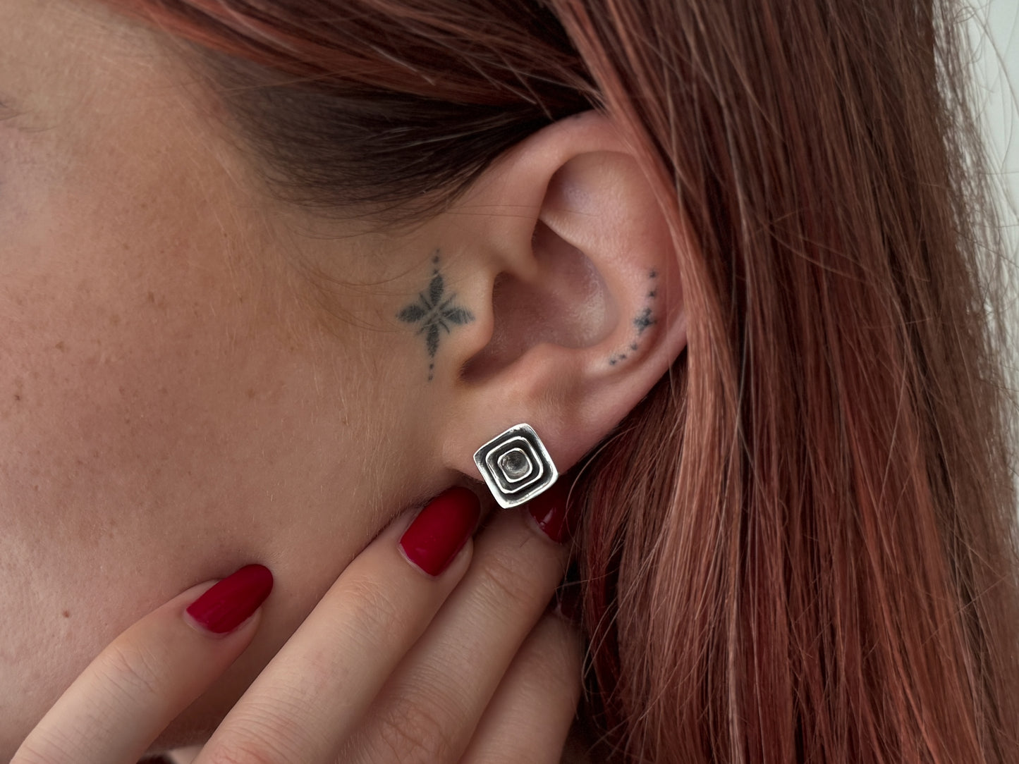 Silver half lotus flower stud earrings
