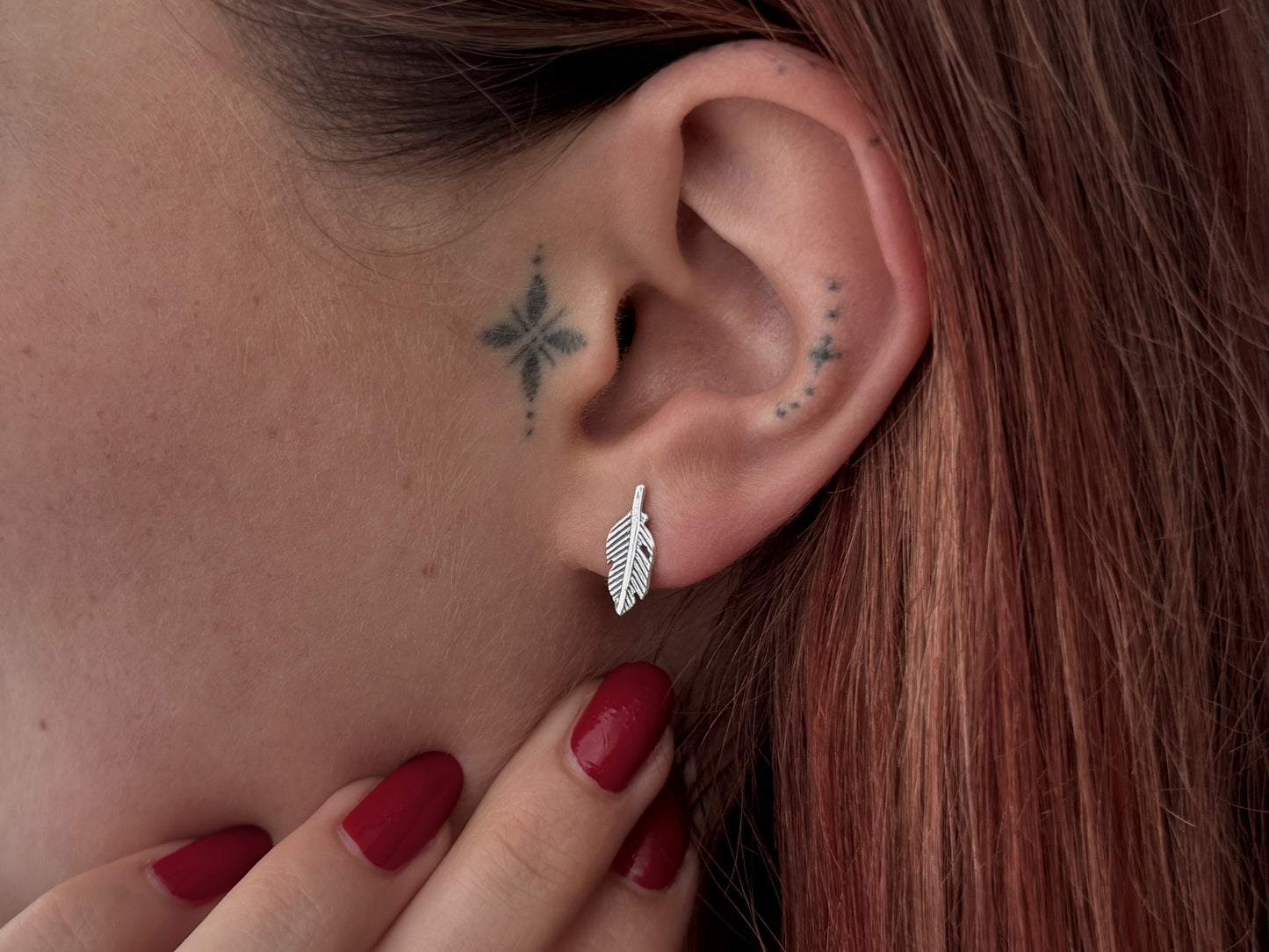 small angel wing stud earrings made of silver