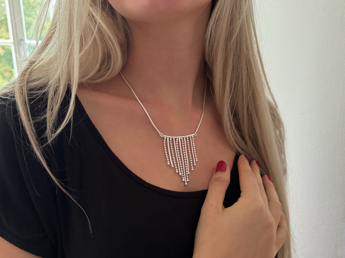 Necklace with small dangling silver chains