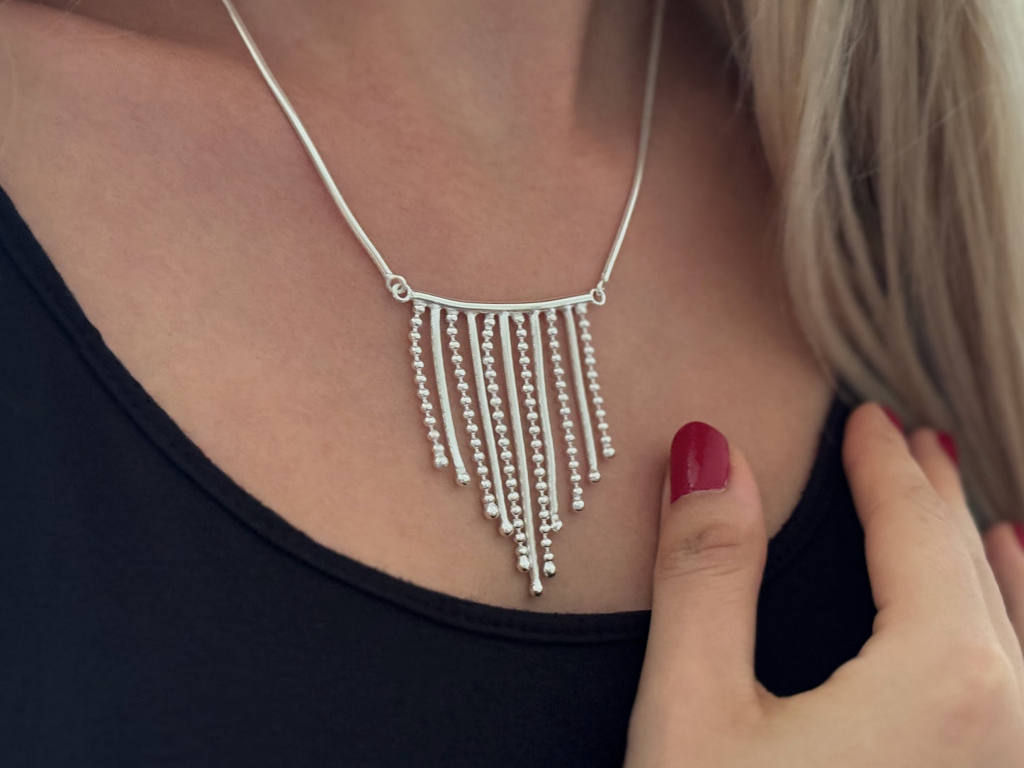 Necklace with small dangling silver chains