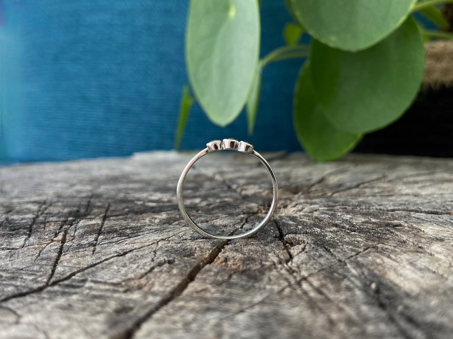 filigree ring with beads and three small faceted stones made of silver