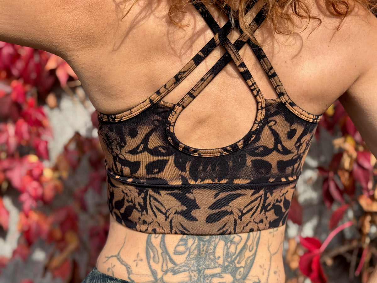Yoga top with the pattern of the flower of life olive green