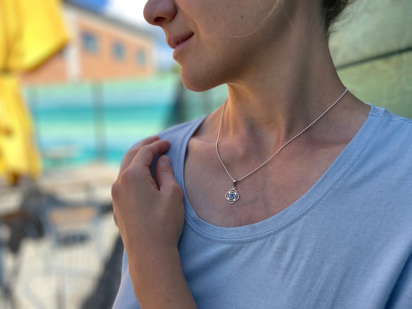 small geometric flower pendant with stone made of silver