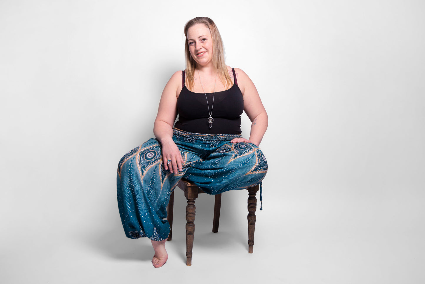 PLUS SIZE harem pants with a peacock pattern in turquoise