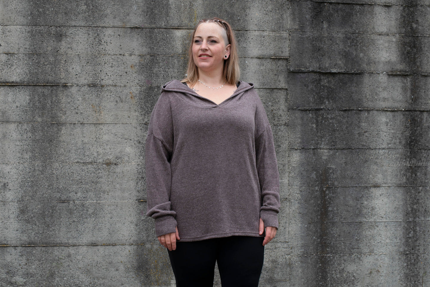 PLUS SIZE, long, plain knitted sweater with a large hood and thumbholes in brown