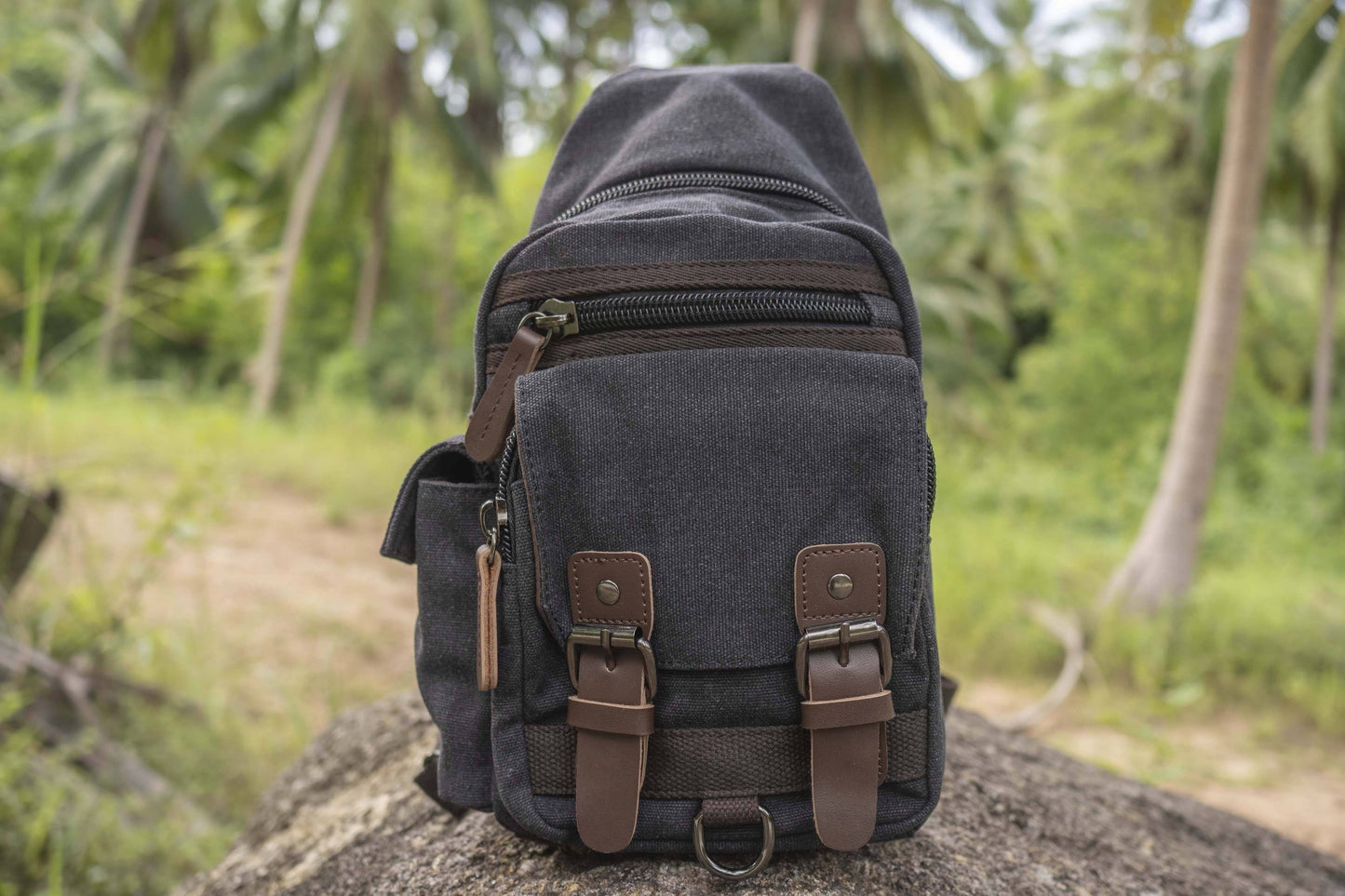 practical canvas shoulder bag with straps in black