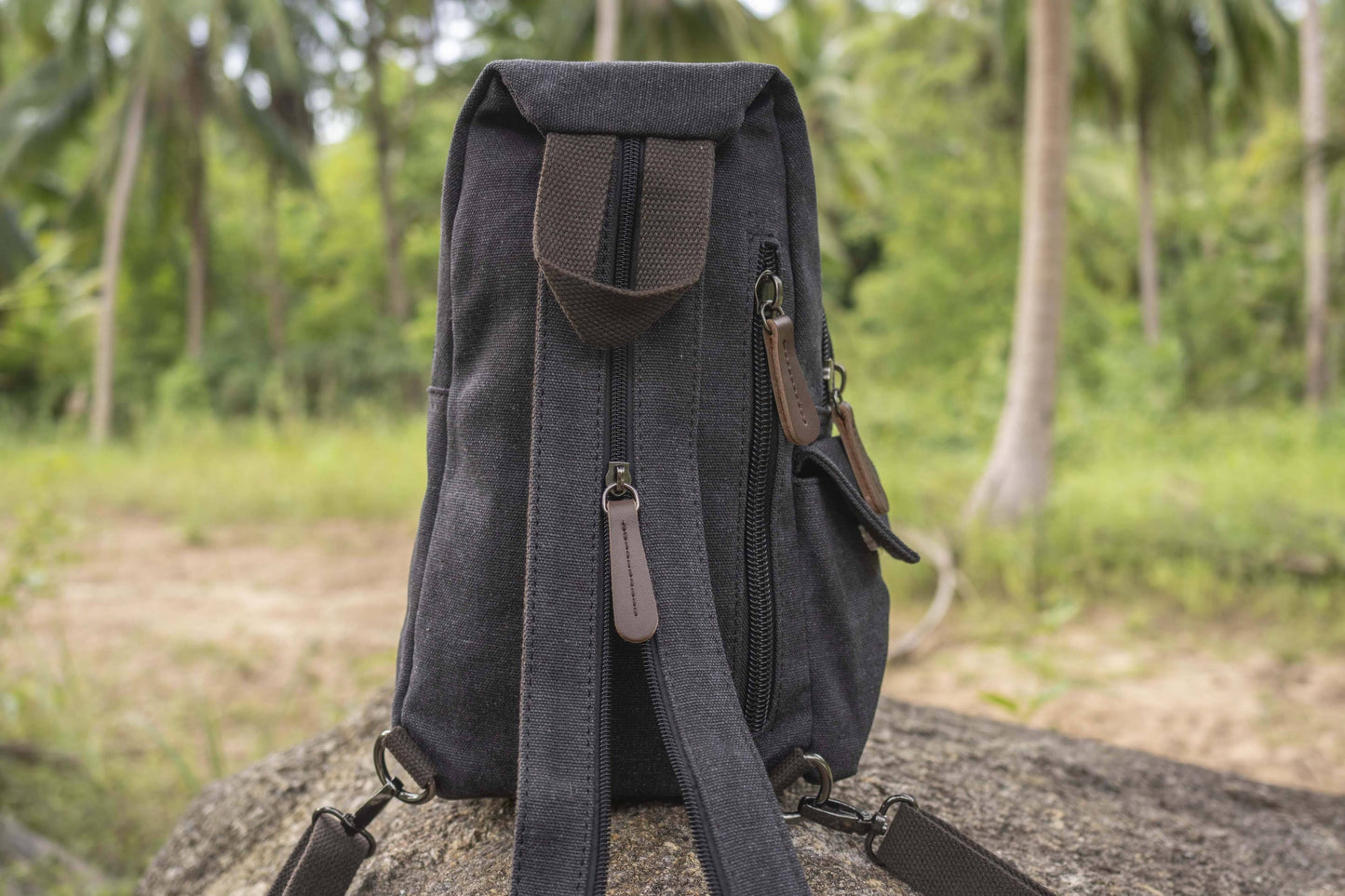 practical canvas shoulder bag with straps in black
