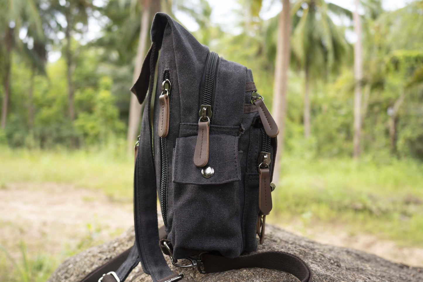practical canvas shoulder bag with straps in black