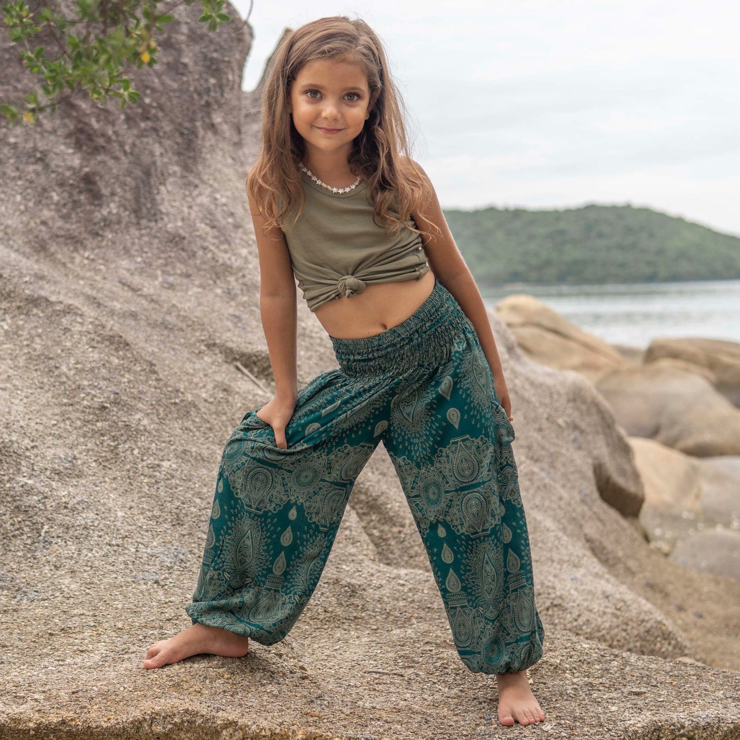 Airy turquoise harem pants with a delicate pattern for children