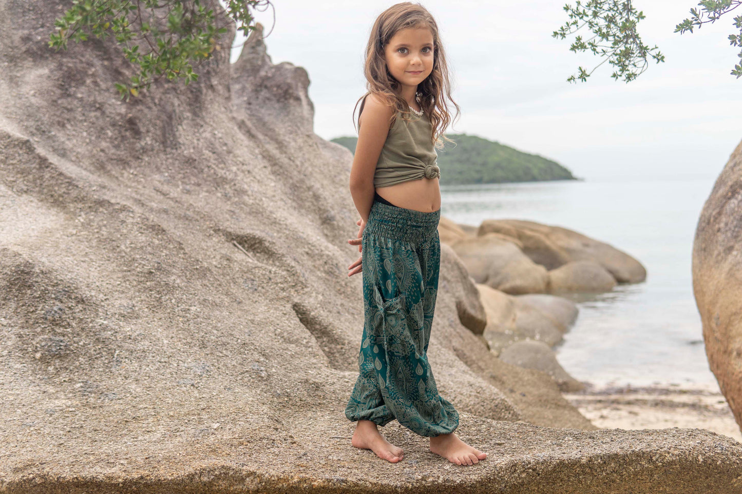 Airy turquoise harem pants with a delicate pattern for children