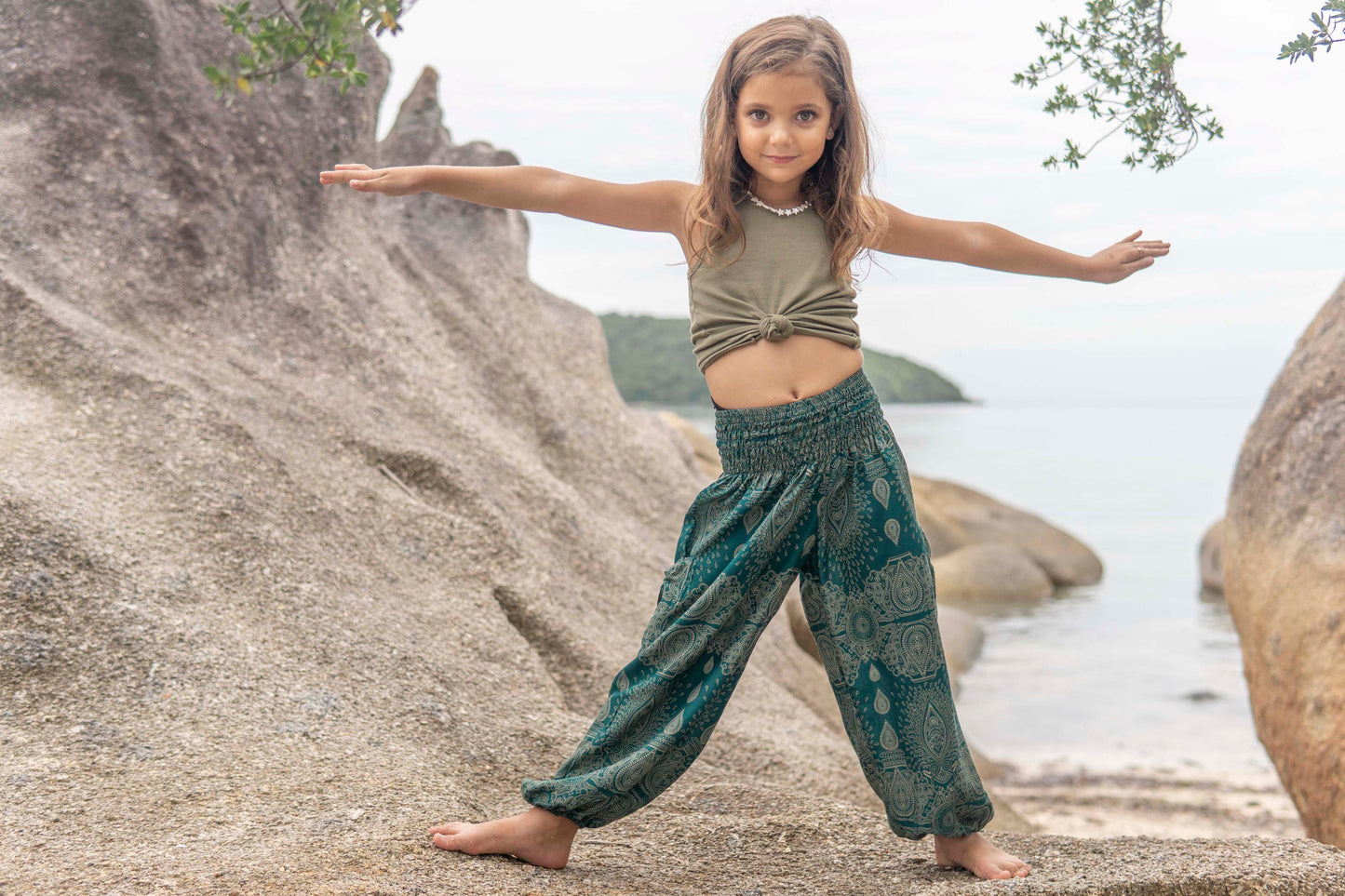 Airy turquoise harem pants with a delicate pattern for children