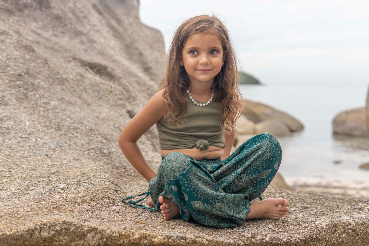 Airy turquoise harem pants with a delicate pattern for children