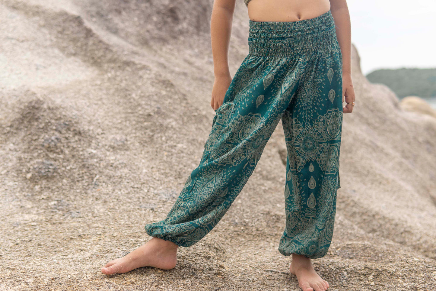 Airy turquoise harem pants with a delicate pattern for children