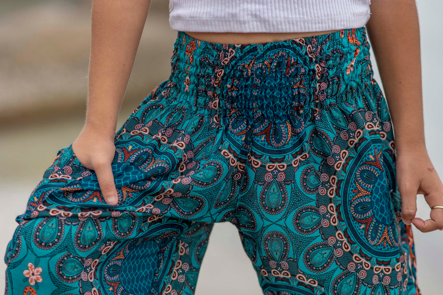 türkis orange gemusterte Pluderhose für Kinder