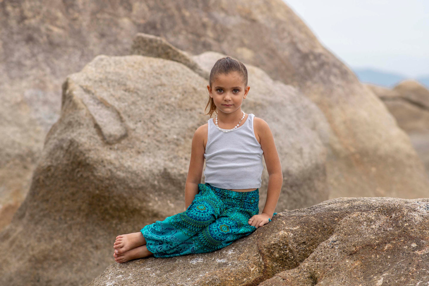 Patterned harem pants with a mandala pattern in blue and turquoise for children