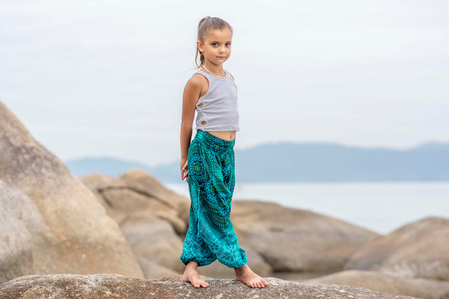 Patterned harem pants with a mandala pattern in blue and turquoise for children