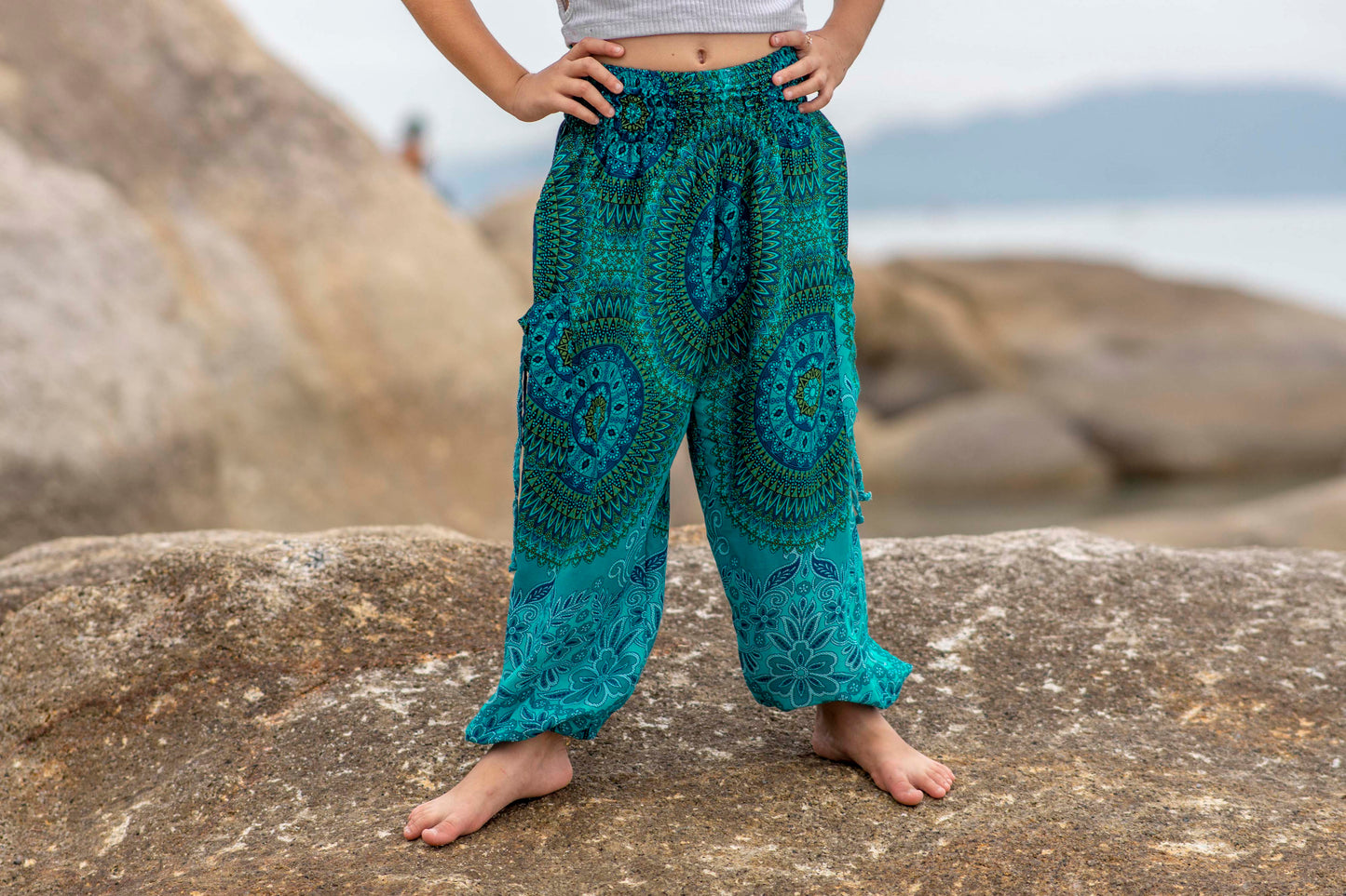 Patterned harem pants with a mandala pattern in blue and turquoise for children