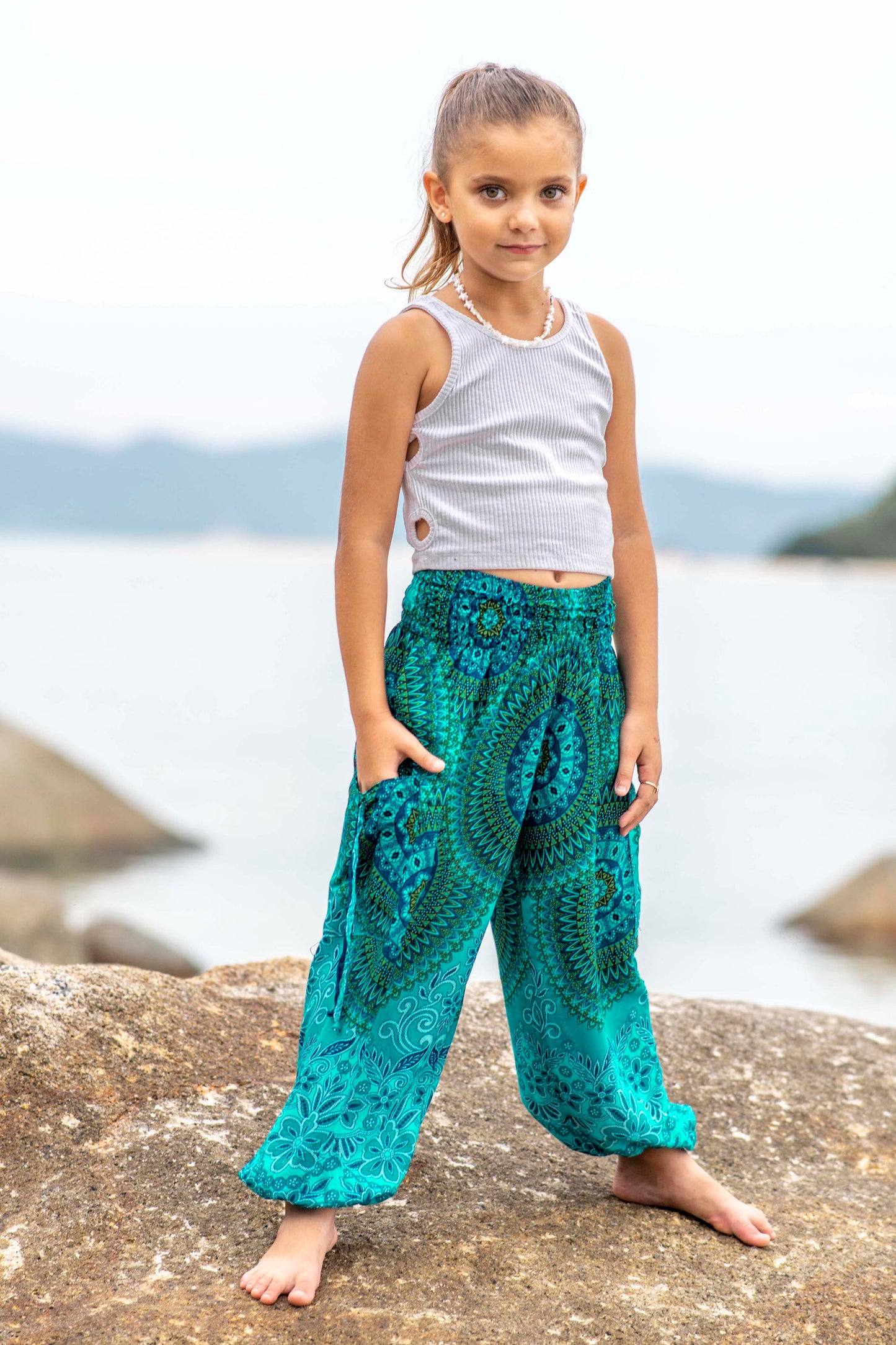 Patterned harem pants with a mandala pattern in blue and turquoise for children