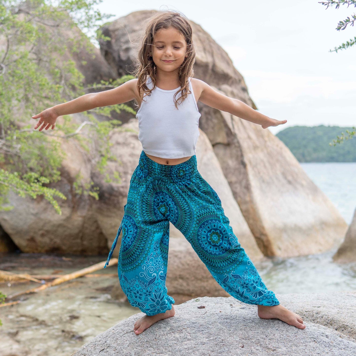 Patterned harem pants with a mandala pattern in blue and turquoise for children