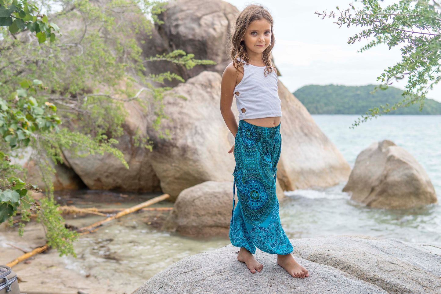 Patterned harem pants with a mandala pattern in blue and turquoise for children