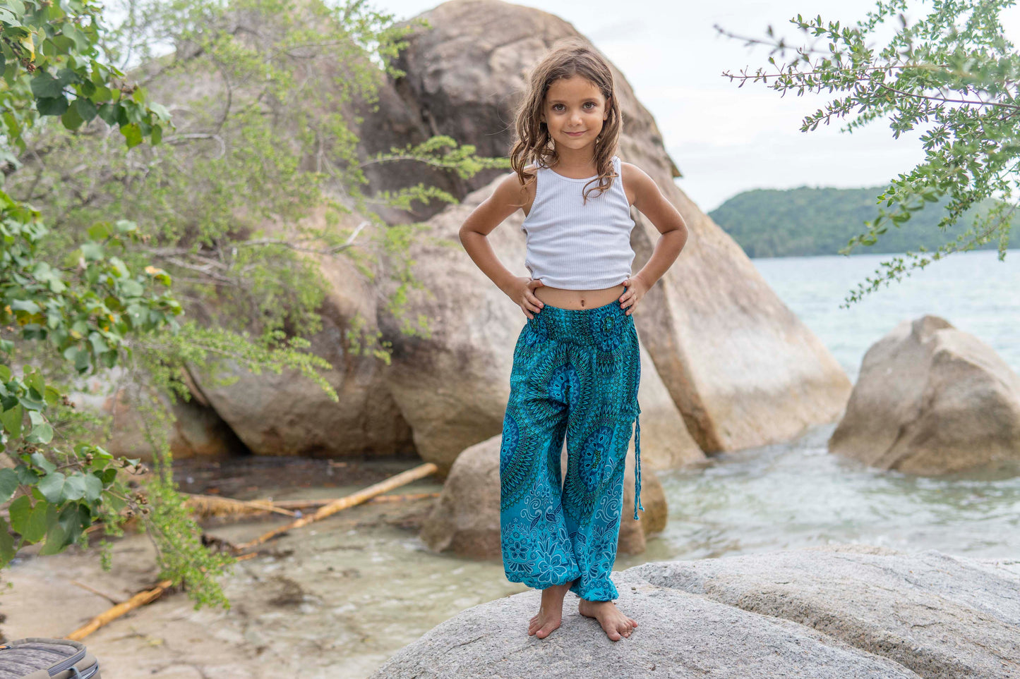 Patterned harem pants with a mandala pattern in blue and turquoise for children