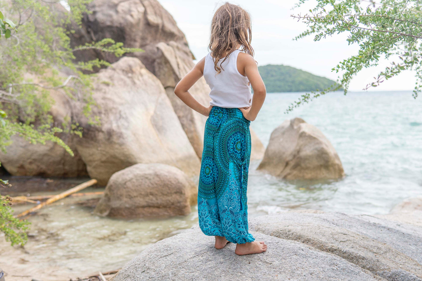 Patterned harem pants with a mandala pattern in blue and turquoise for children