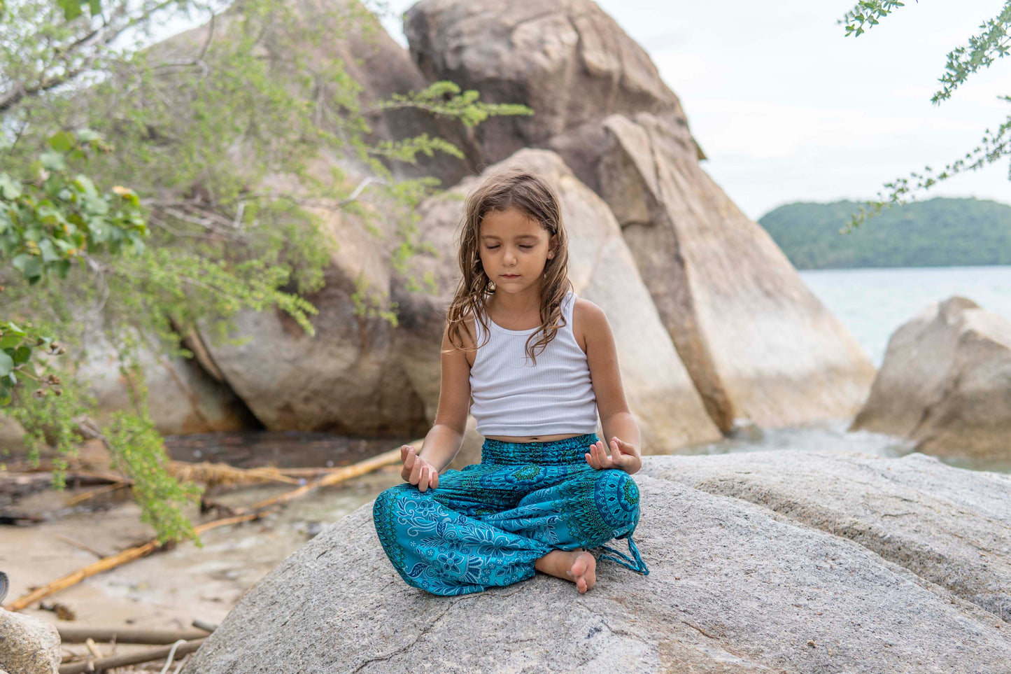 Patterned harem pants with a mandala pattern in blue and turquoise for children