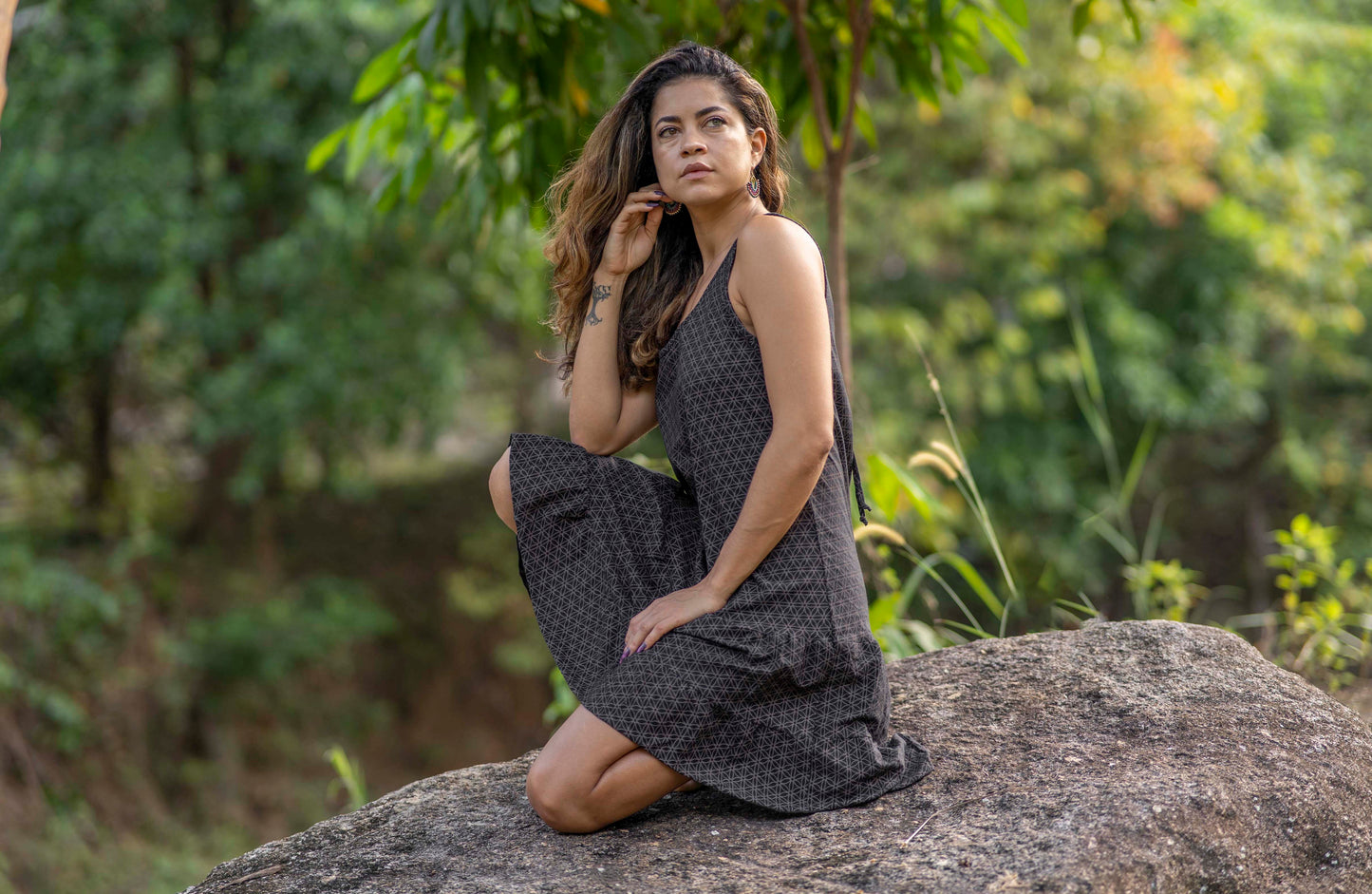 Sleeveless dress with ruffles, black with the flower of life pattern
