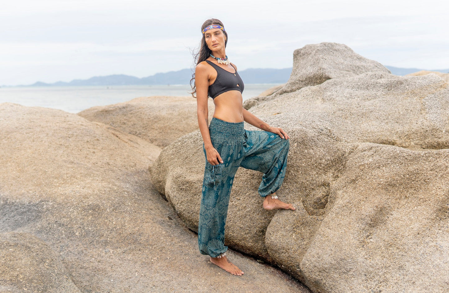 Airy harem pants with a filigree pattern in turquoise