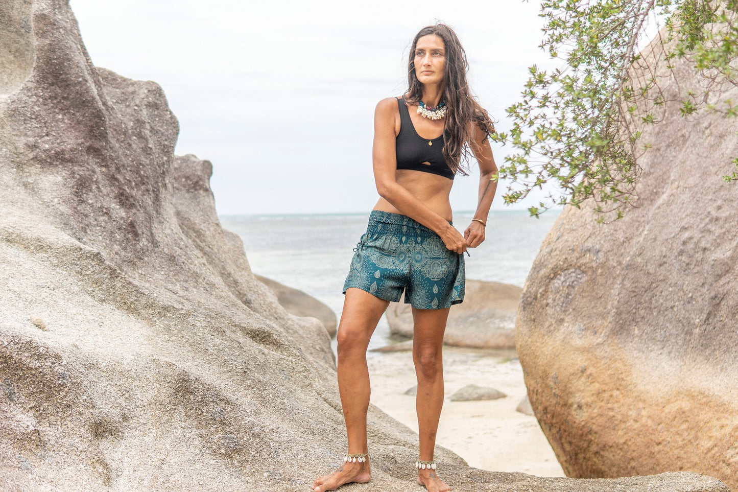 Airy, light summer shorts with a filigree pattern in turquoise