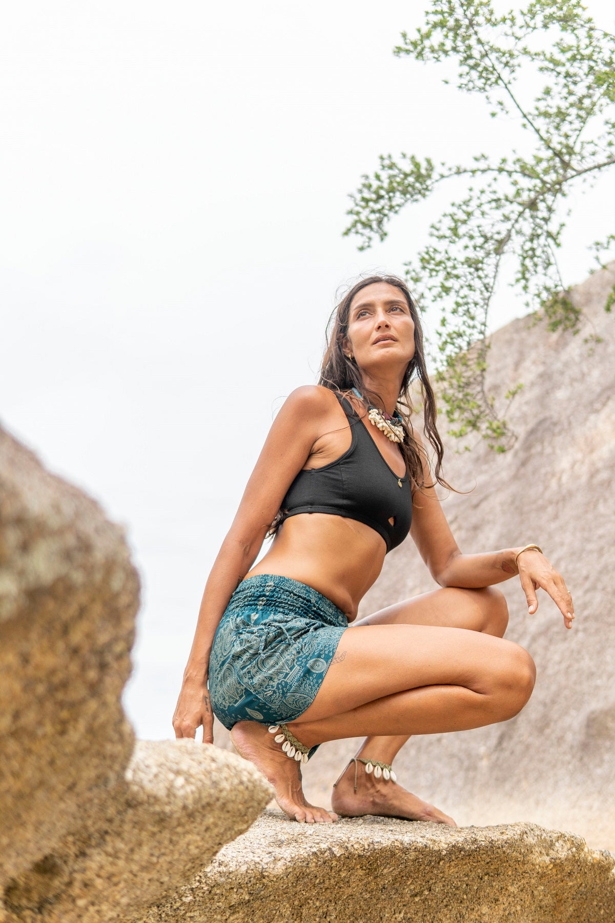 Airy, light summer shorts with a filigree pattern in turquoise