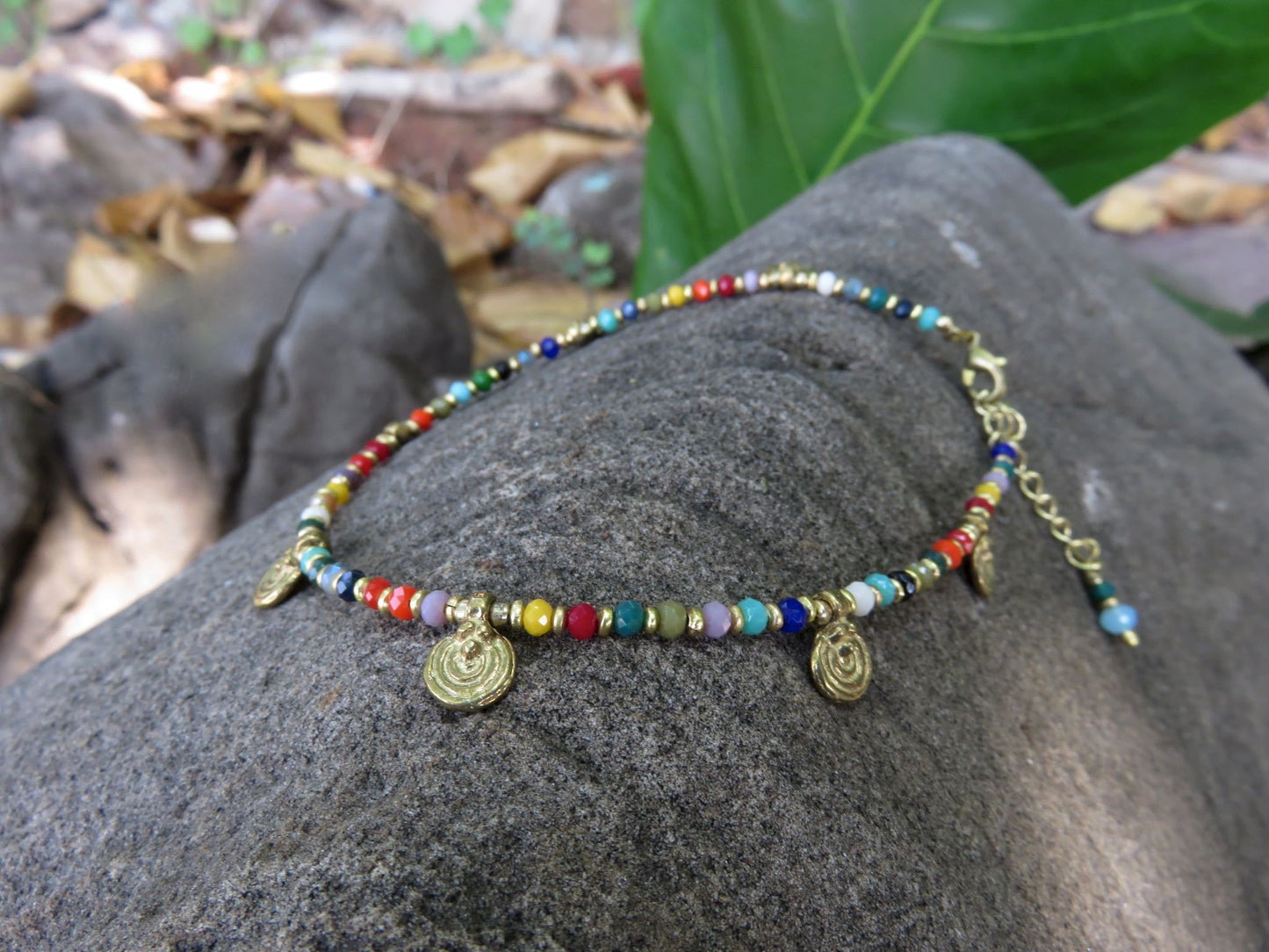 colorful anklet with small spirals made of brass