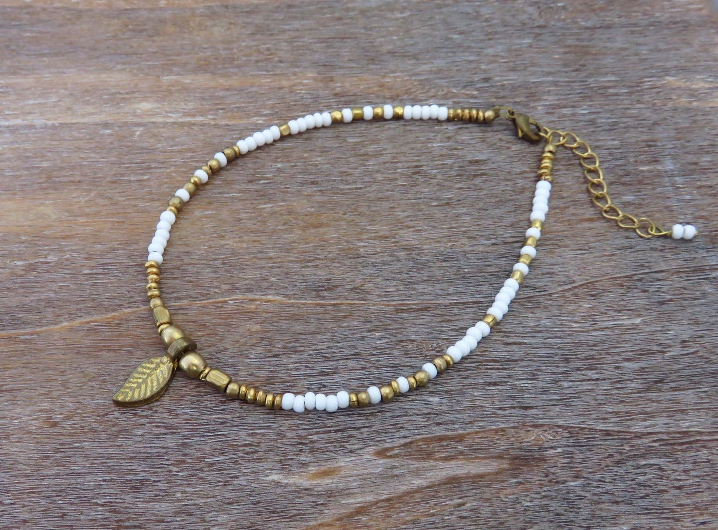 Anklet with small brass leaf and colored beads