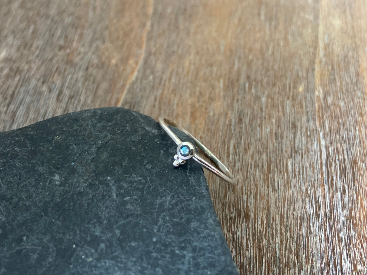 Dainty silver ring with a small faceted labradorite stone and three beads