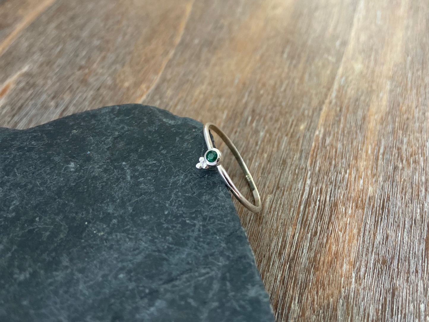 Dainty silver ring with a small faceted green emerald stone and three beads