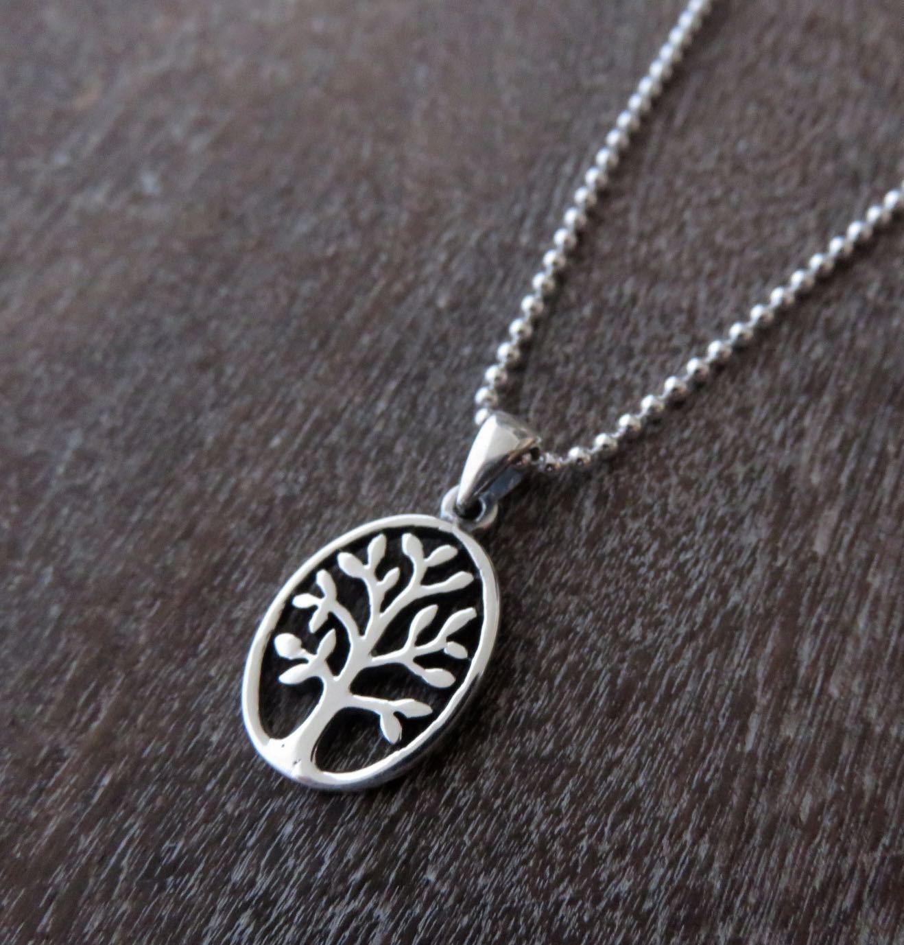 Oval pendant with the motif of the tree of life made of silver