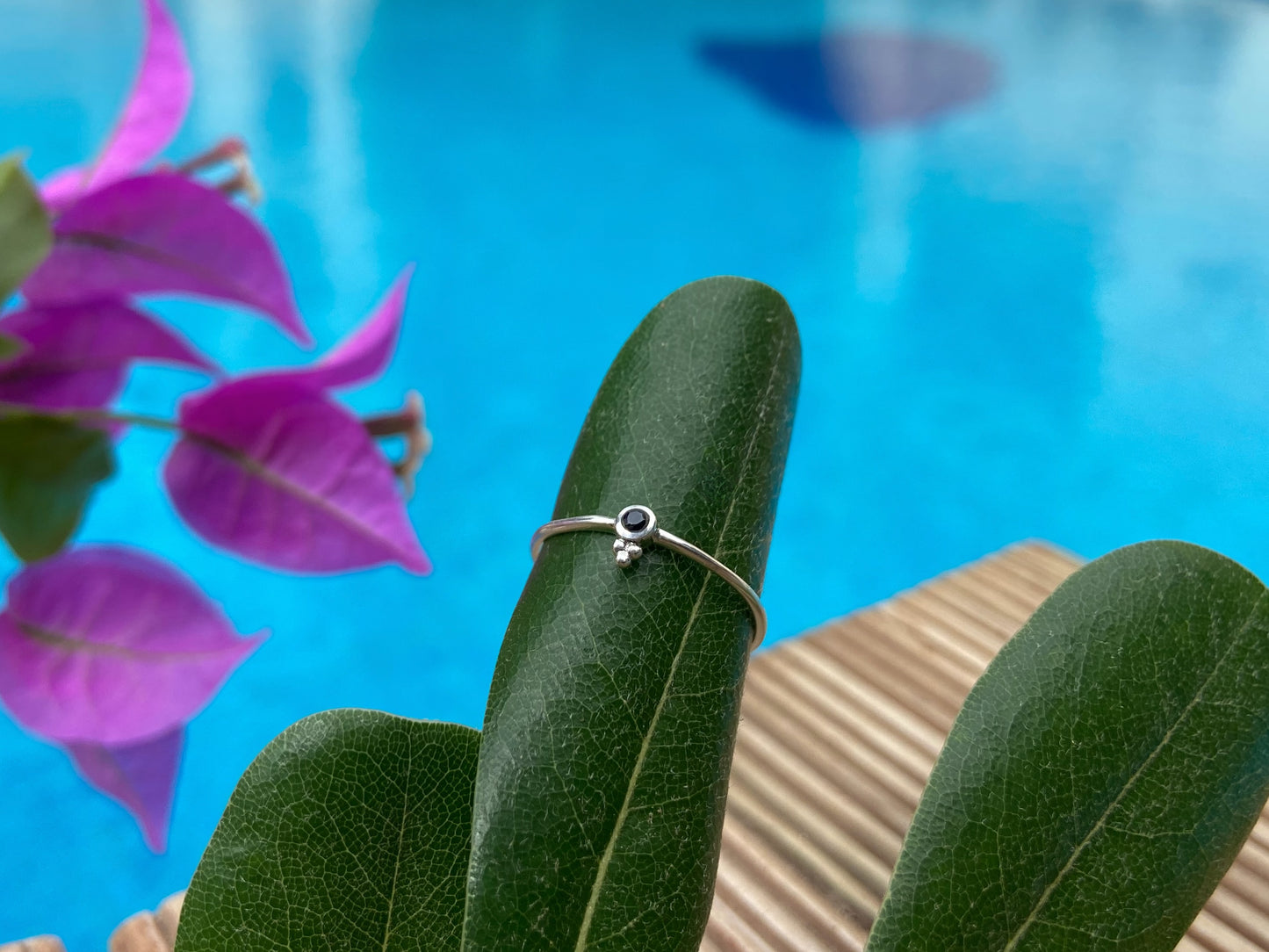 Dainty silver ring with a small faceted black spinel stone and three beads