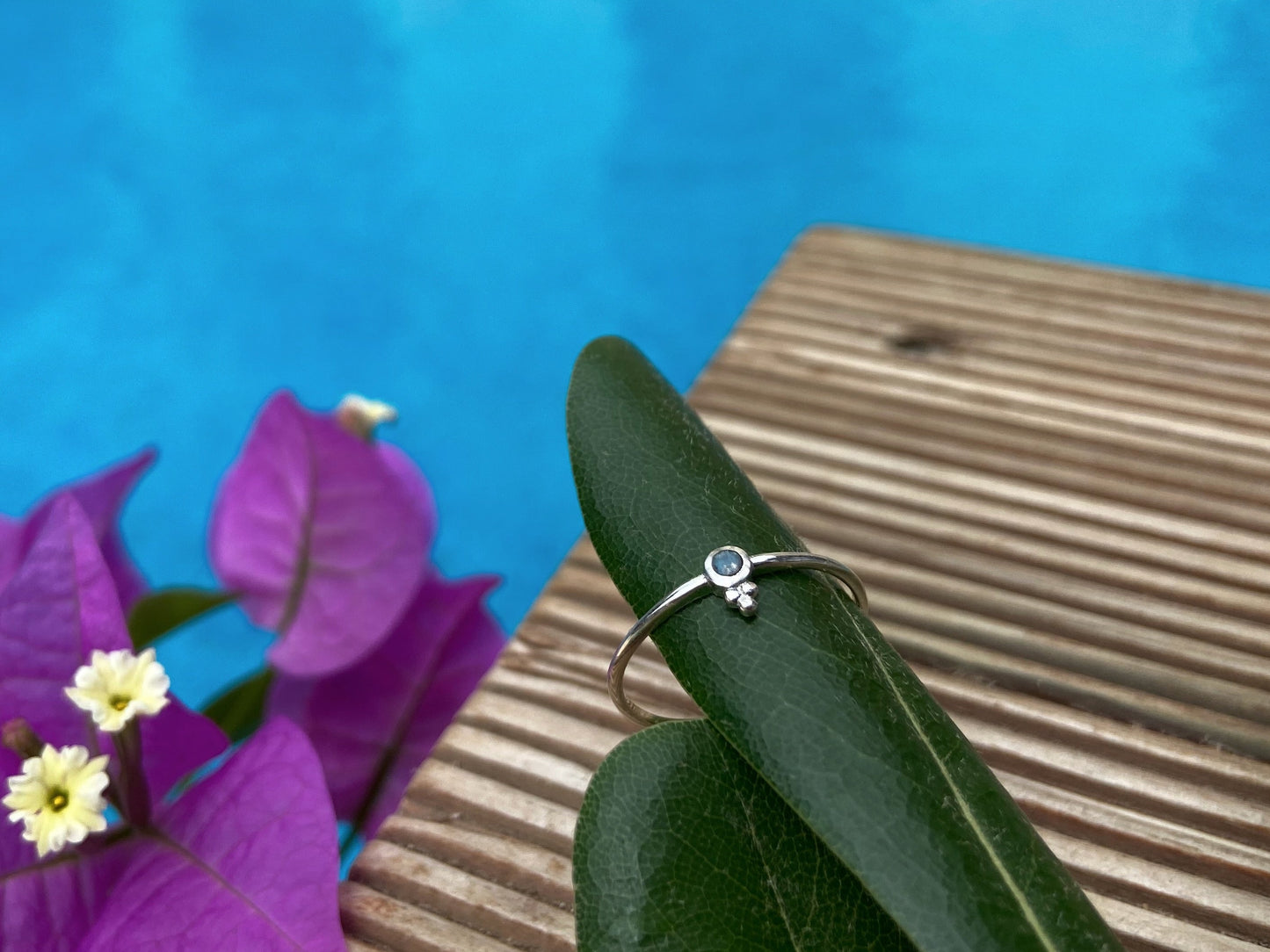 Dainty silver ring with a small faceted labradorite stone and three beads