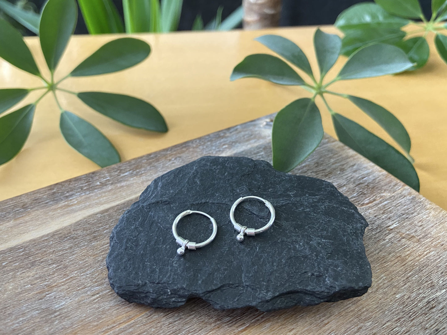 small silver hoop earrings with leaves, beads and beads