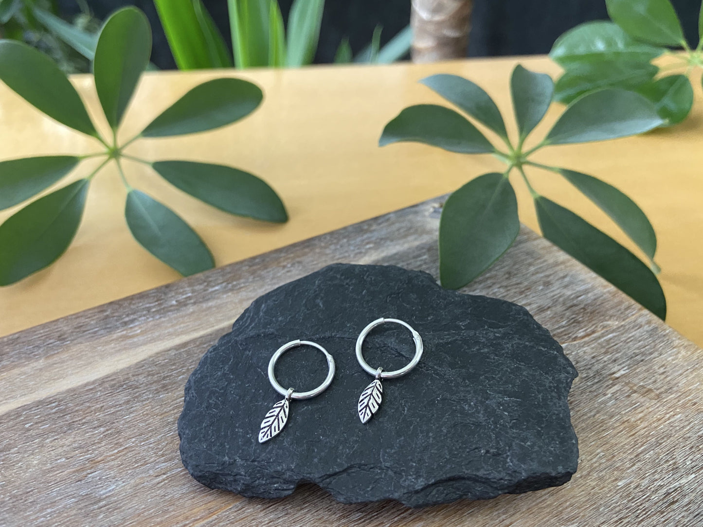 small silver hoop earrings with leaves, beads and beads