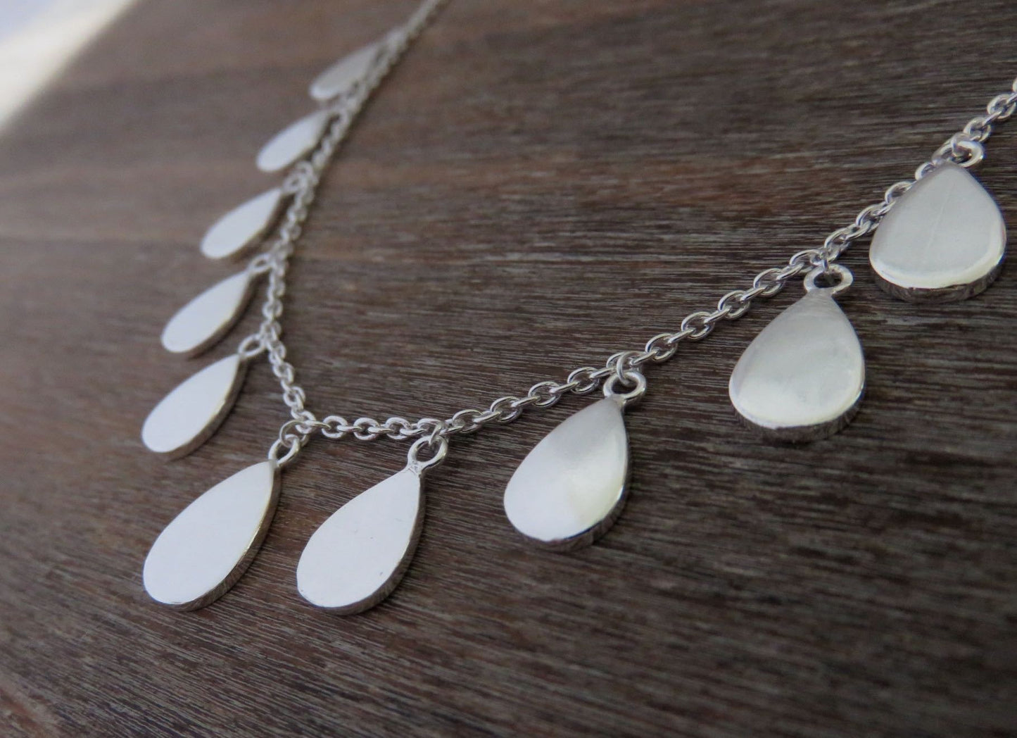 Necklace with small teardrop-shaped pendants made of silver