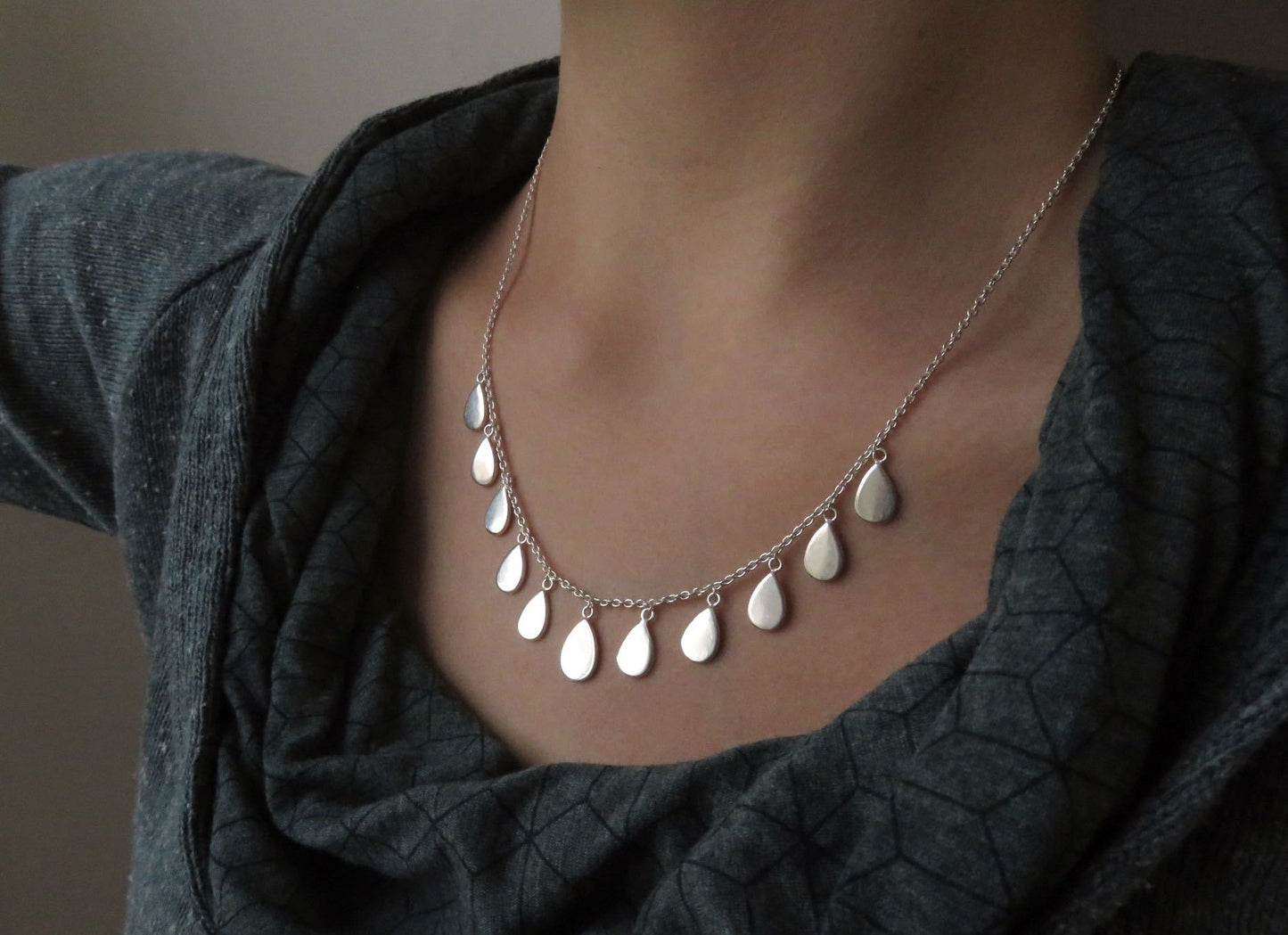 Necklace with small teardrop-shaped pendants made of silver