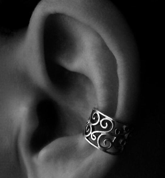 Ear clip with small silver spirals