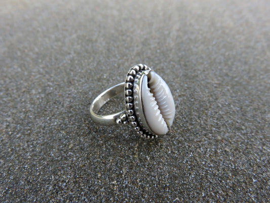 Ring with cowrie shell decorated with small silver beads