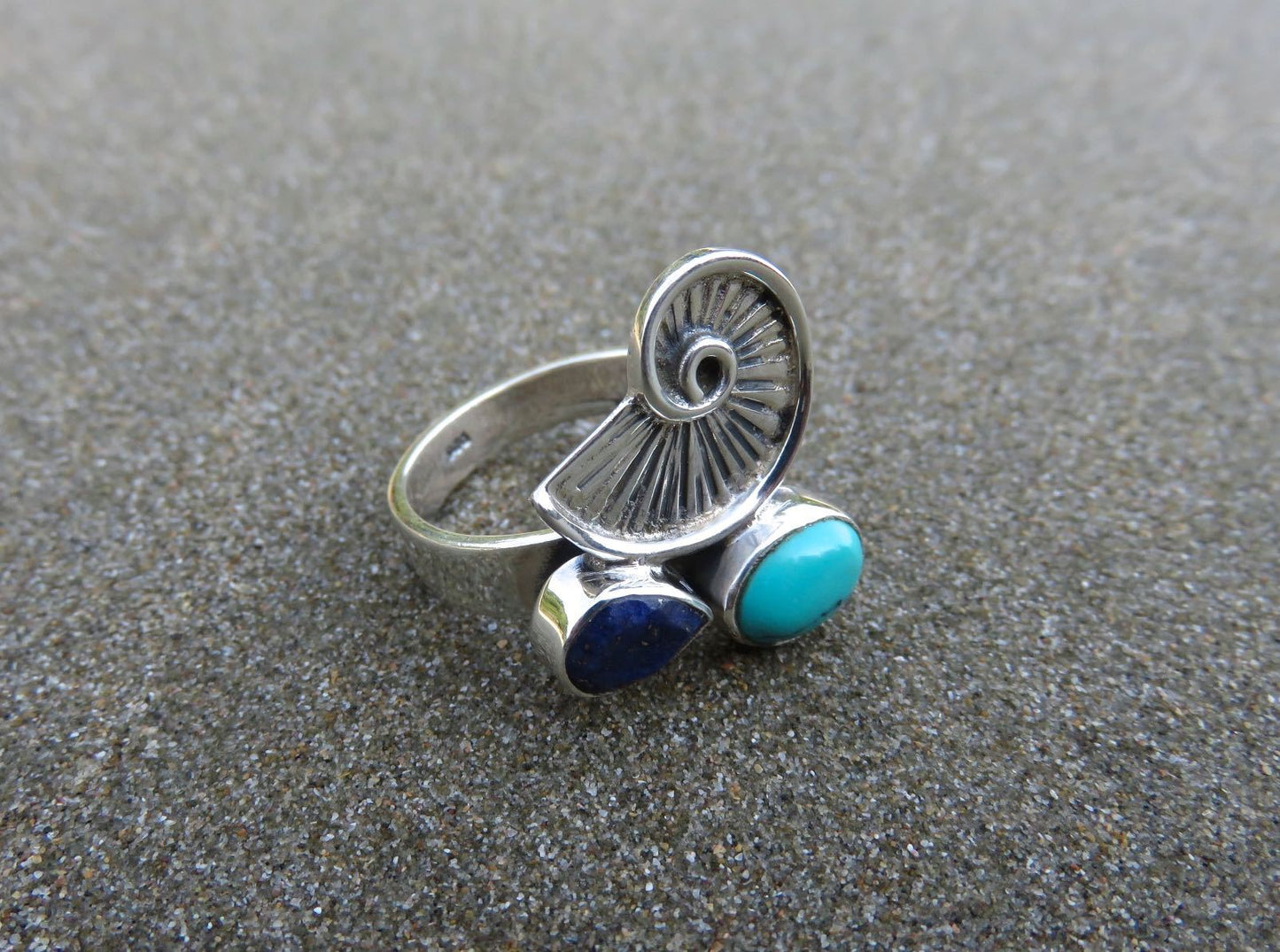 Ring with snail and stones made of silver