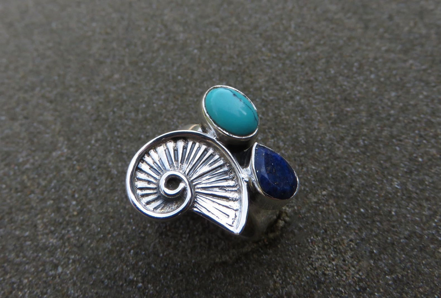 Ring with snail and stones made of silver
