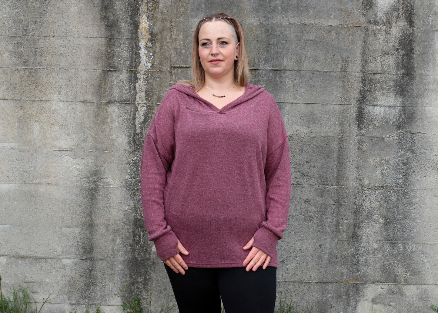 PLUS SIZE, long, plain knitted sweater with a large hood and thumbholes in red